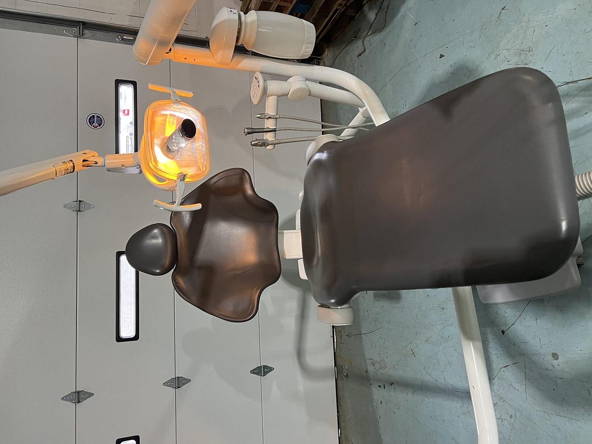 Used Adec 511 dental chair w/ radius 332 delivery system, light, and assistant package