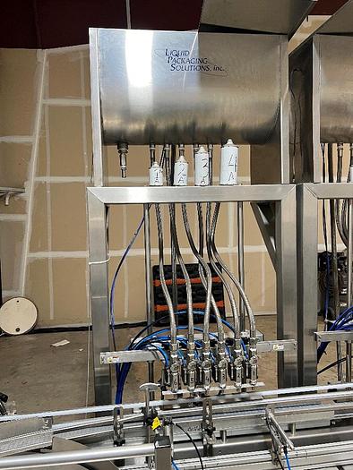 Used Filling Line, 12-Head, Overflow Filler, Inline Capper, Wrap Labeler #C745379