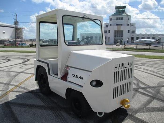 Used 1999 Harlan HTAG50 with Cab, baggage tow tractor. Power Steering.