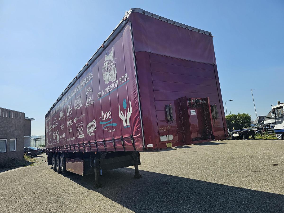 Used 2000 schmitz S01 | SLIDING ROOF | 2 LIFT AXLES| NICE HOLLAND TRAILER| SAF DISC.