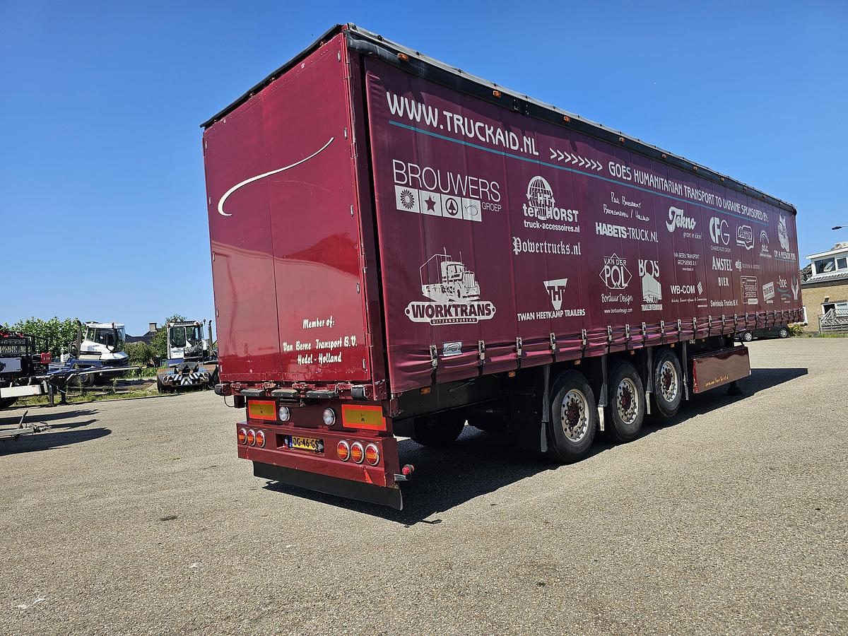 Used 2000 schmitz S01 | SLIDING ROOF | 2 LIFT AXLES| NICE HOLLAND TRAILER| SAF DISC.