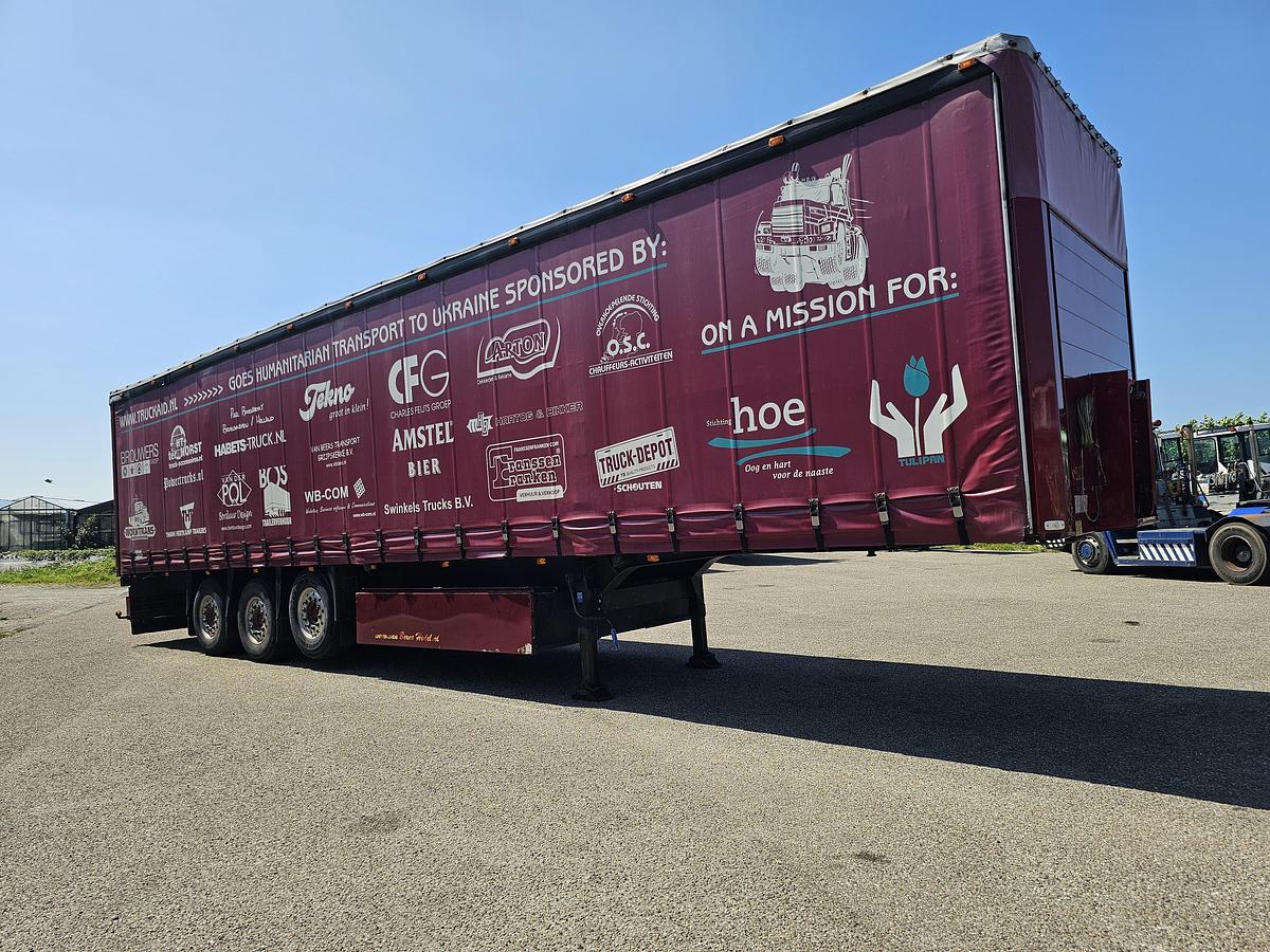 Used 2000 schmitz S01 | SLIDING ROOF | 2 LIFT AXLES| NICE HOLLAND TRAILER| SAF DISC.