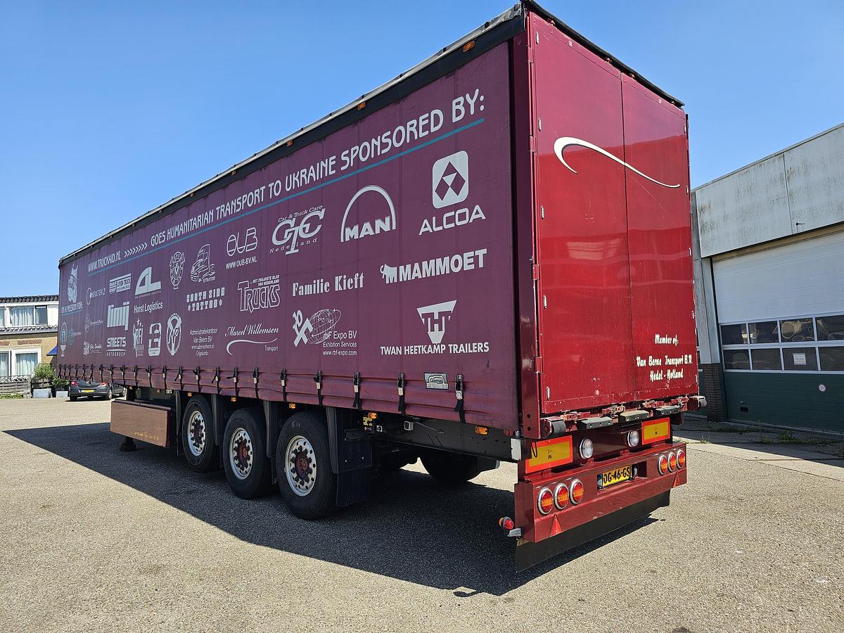 Used 2000 schmitz S01 | SLIDING ROOF | 2 LIFT AXLES| NICE HOLLAND TRAILER| SAF DISC.