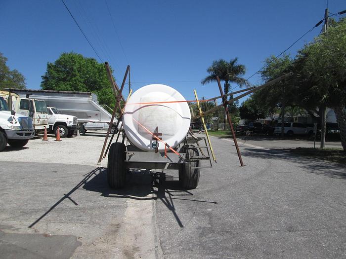 Used 1000 Gallon Pull Behind Boom Sprayer