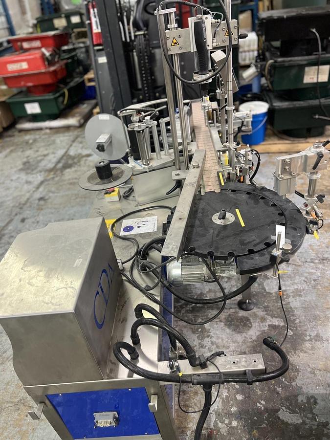 Used Used CDA Wraparound Bottle Labeler Model E-Fill