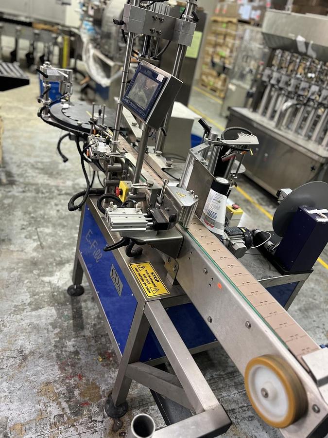 Used Used CDA Wraparound Bottle Labeler Model E-Fill
