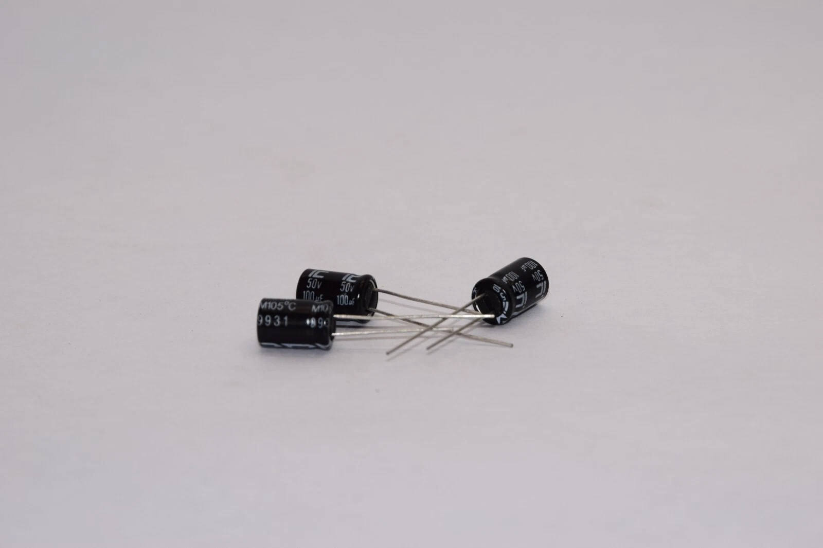 (NEW - Lot 3) ILLINOIS CAPACITOR 107CKHM050M 50V 100uF Capacitor
