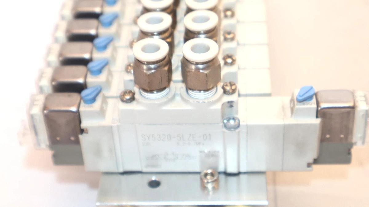 Used SMC Valve Block Assembly with (9) SY5120-5LZE-01 & (1) SY5320-5LZE-01 Valves