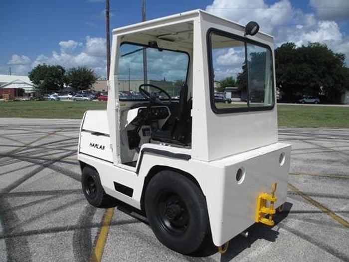 Used 1999 Harlan HTAG50 with Cab, baggage tow tractor. Power Steering.