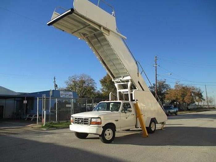 Used Hobart/Wollard Stair Truck. Services wide body aircraft. Max Height 17' Model: TLPH252SM.