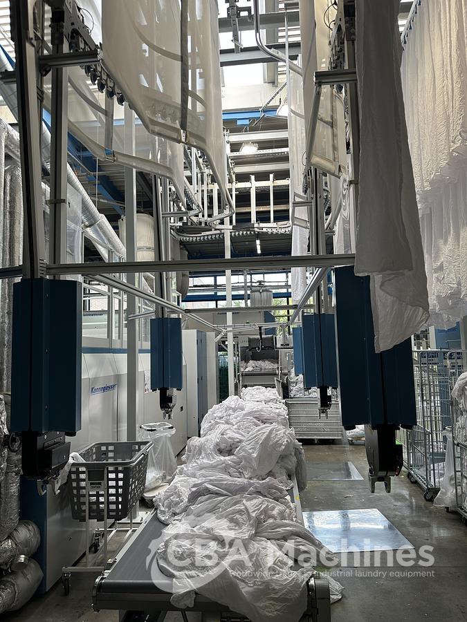 Used 2023 Kannegiesser Ironing Line EMA 40-01+2-2/4-1/2 (1053) + HPM-II 3 x 1200 x 4000mm (1054) + SFM-E 40(42)-1/2-3-KR3-R-ISP6 (1055)