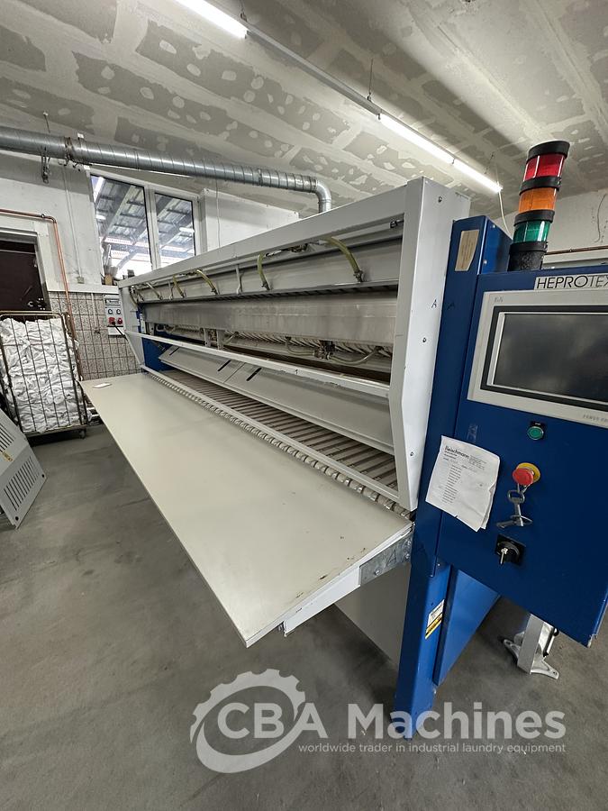 Used 2013 Lapauw small piece ironing line with vacuum table 1 roll 1600 Gas ironer and unifold 