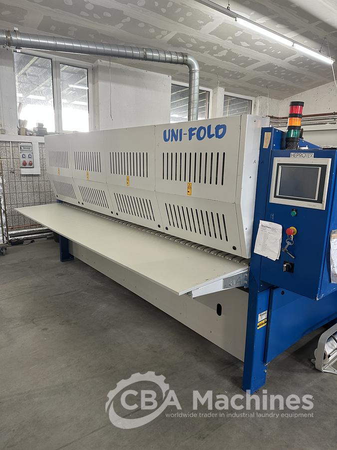 Used 2013 Lapauw small piece ironing line with vacuum table 1 roll 1600 Gas ironer and unifold 