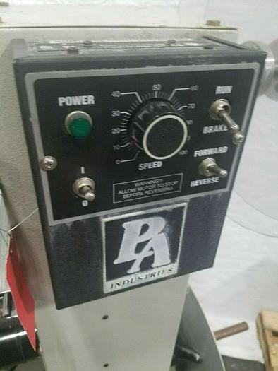 Used PA Industries Double Coil Motorized Stock Reel with Paper Interleaf Payoff Feed