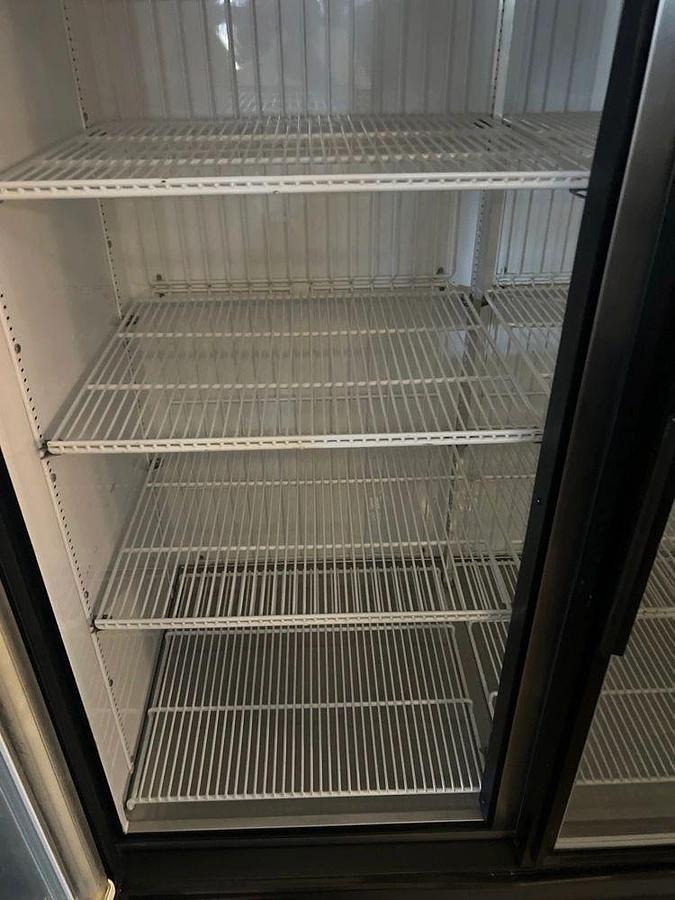 Used True GDM-49F Two Section Display Freezer w/ Right Hinged Swing Doors - Bottom Mount Compressor, BlackTrue GDM-49F Two Section Display Freezer w/ Right Hinged Swing Doors - Bottom Mount Compressor, Black