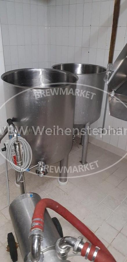 Used open conical stainless steel vessel