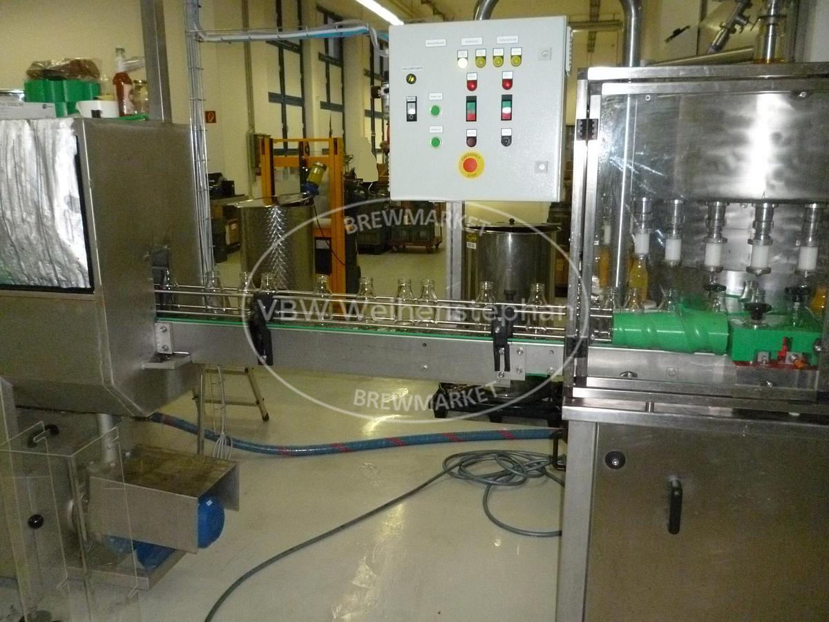 Used glass bottle vacuum filler