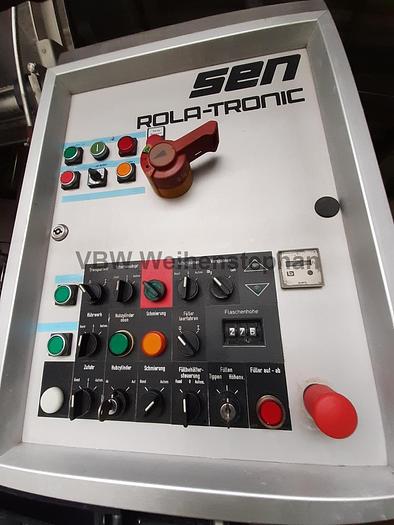 Used glass bottle filler and capper