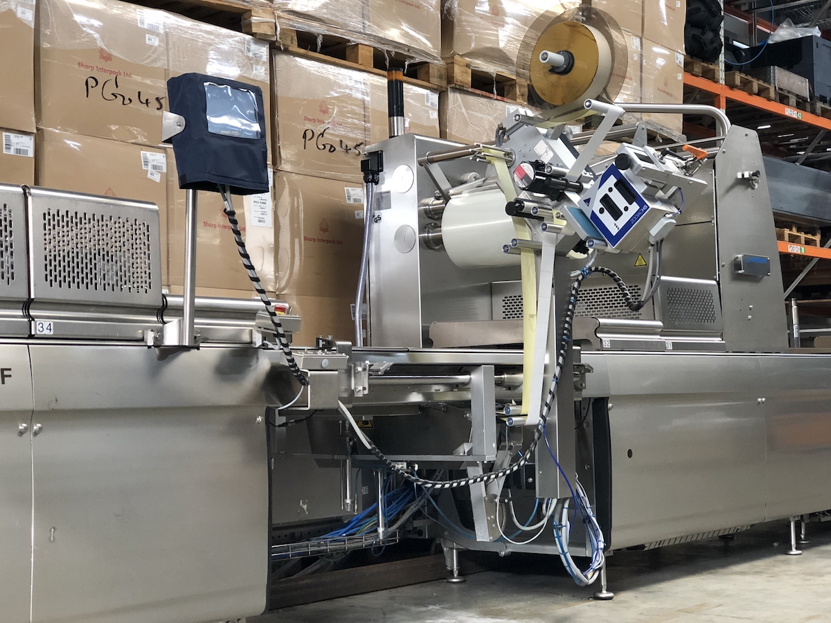 Used Multivac R275mf skin-pack thermoformer with automatic labelling machine