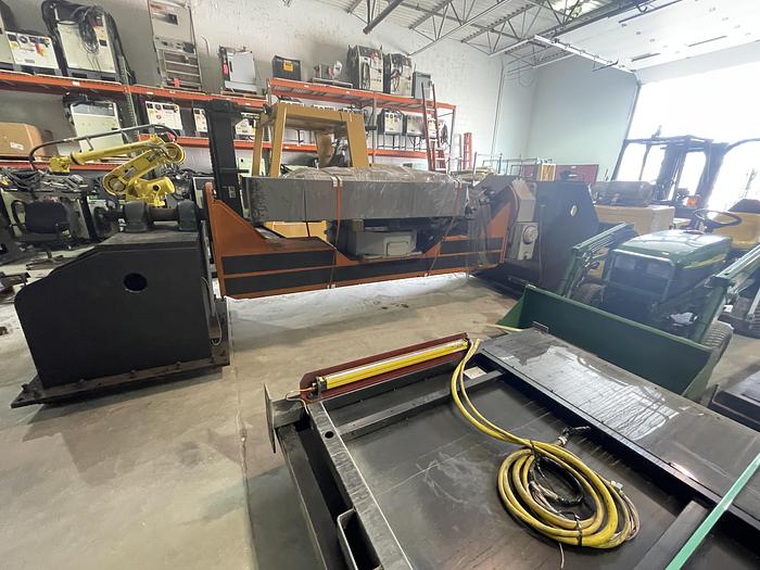 Used FANUC ARCMATE 120iC/10L MIG WELDING CELL WITH 2 AXIS 10' LONG DROP CENTER TRUNNION W/ROTARY CNC TABLE