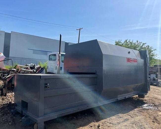 Used 20 yard PTR self contained compactor
