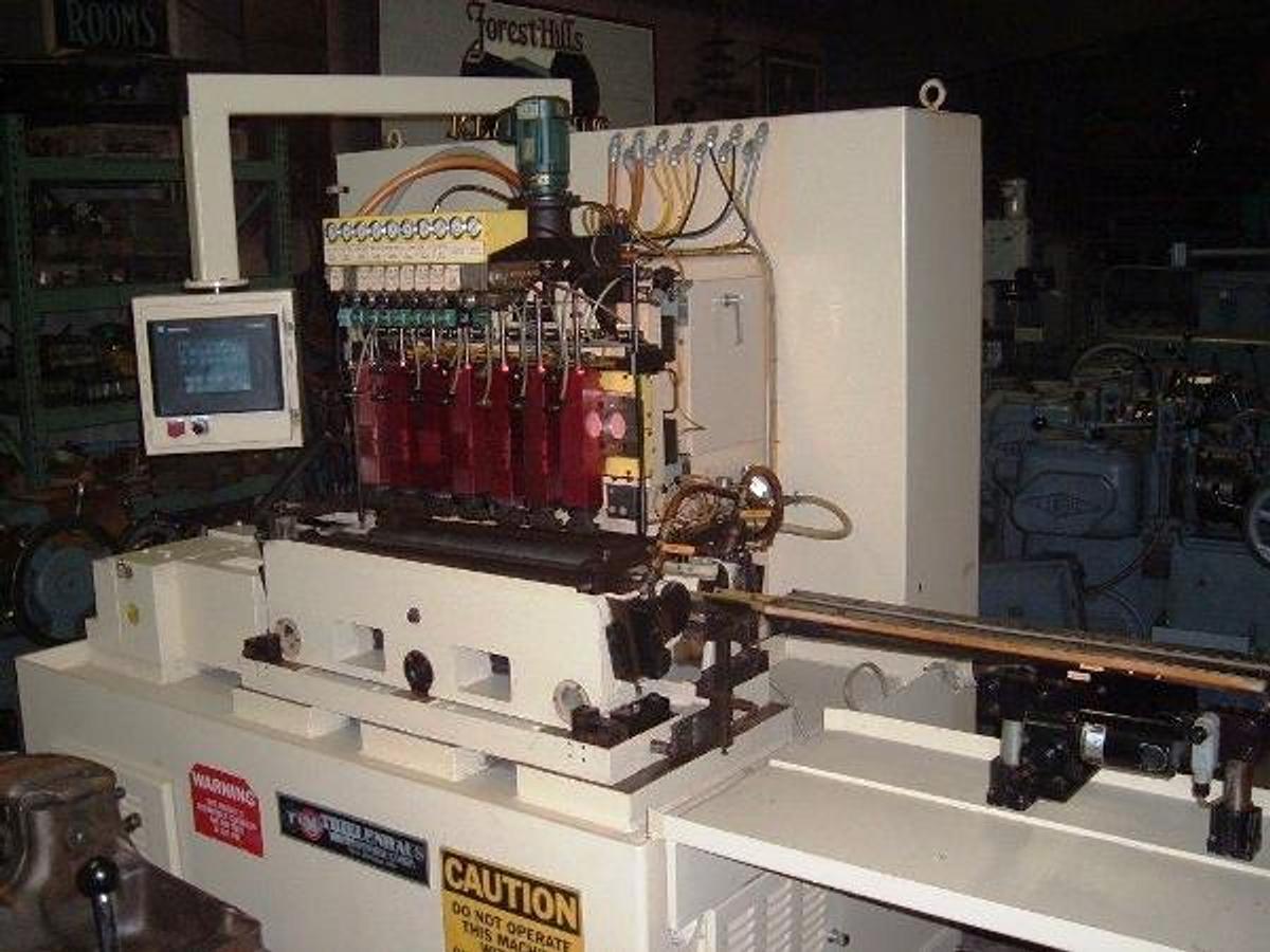 Used Thielenhaus #SF125, thru feed, 8 each heads, will take 10 heads, 1999