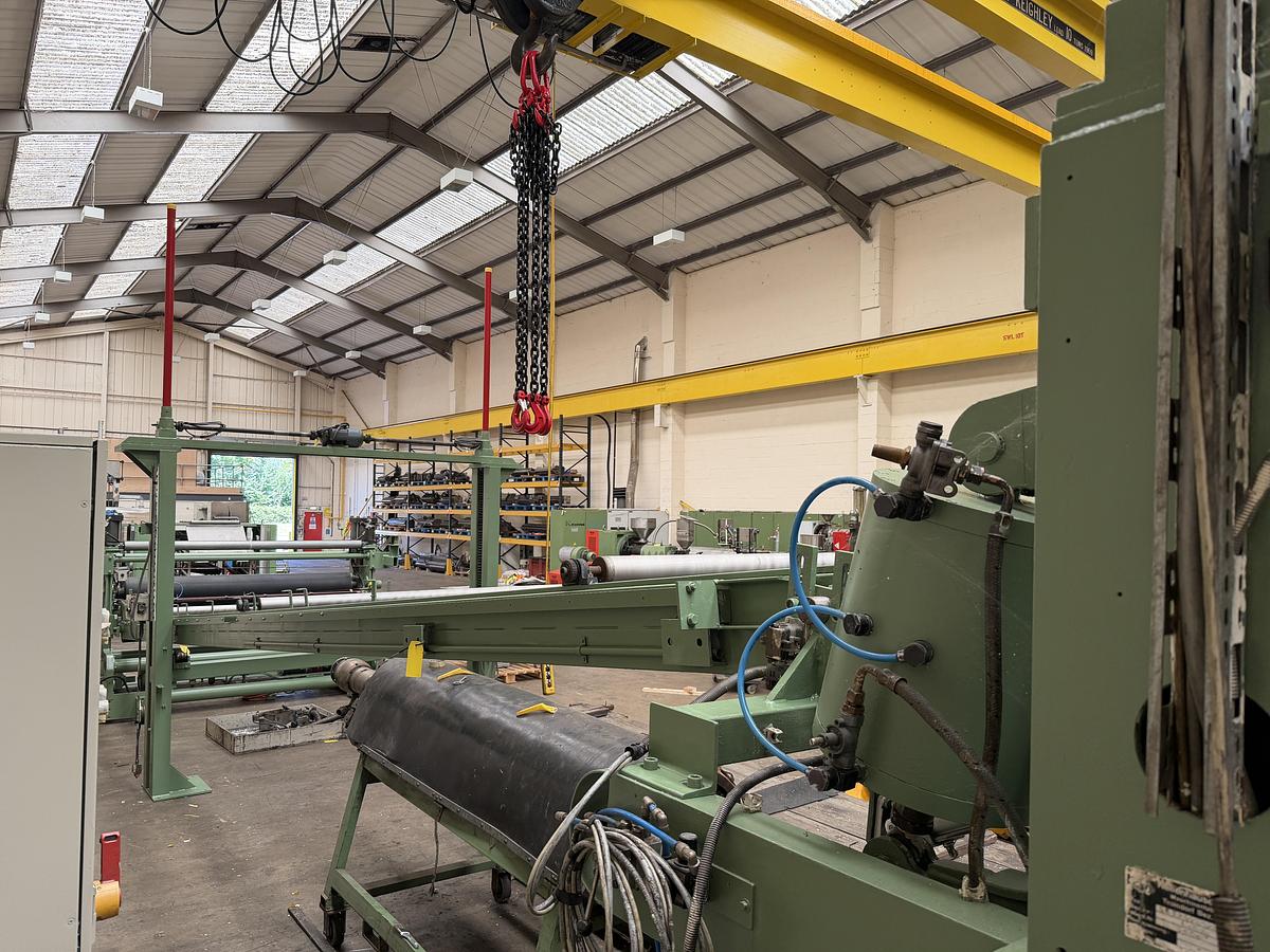 Used 2400mm wide Reifenhauser 3 roll polishing stack with thermoregulation, haul off. 2400mmx500mm individual drives. Variable speed haul off. In line knives.