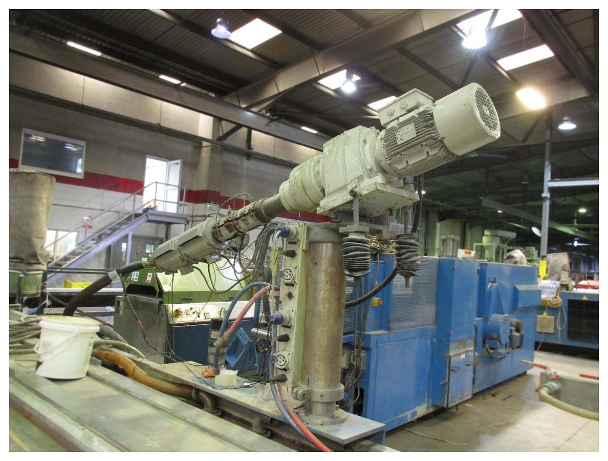 Used 90mm Krauss Maffei Coex Upvc Profile 1992. 90mm Twind Screw Extruder. 30mm Co Extruder. Calbration  Table, Saw Unit.