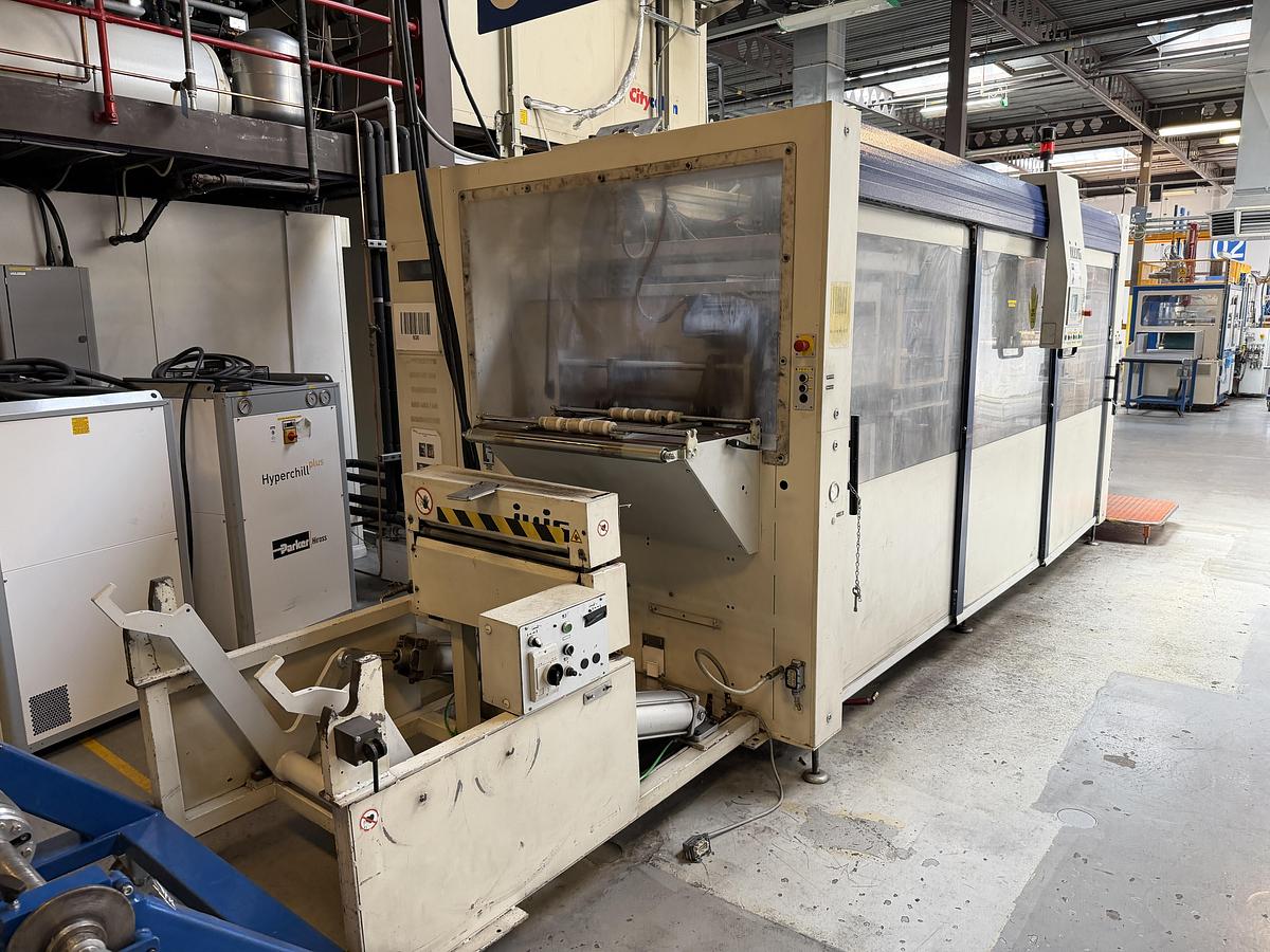 Used 500mm x 350mm Illig Model RD53 pressure forming machine 2004 with unwind and stacker