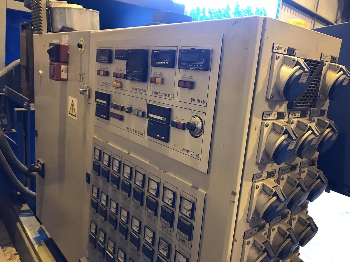 Used 90mm Dolci single screw extruder, 33D, with plugged vent. DC motor, approx 90kw. Electrically heated, fan cooled barrel. 20 zone temperature control panel