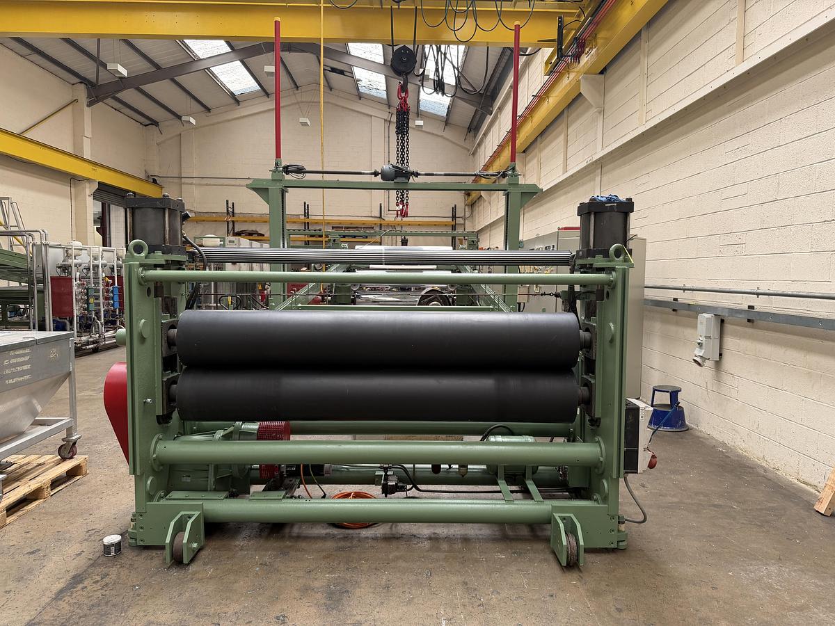 Used 2400mm wide Reifenhauser 3 roll polishing stack with thermoregulation, haul off. 2400mmx500mm individual drives. Variable speed haul off. In line knives.