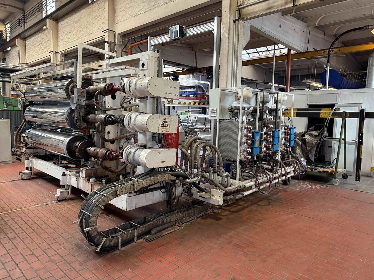 Used 2400mm wide Reifenhauser 3 roll polishing stack with thermoregulation, haul off. 2400mmx500mm individual drives. Variable speed haul off. In line knives.