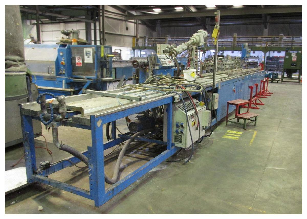 Used 90mm Krauss Maffei Coex Upvc Profile 1992. 90mm Twind Screw Extruder. 30mm Co Extruder. Calbration  Table, Saw Unit.