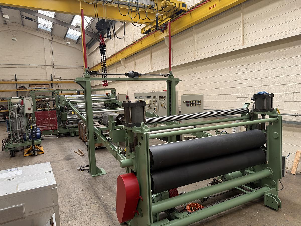 Used 2400mm wide Reifenhauser 3 roll polishing stack with thermoregulation, haul off. 2400mmx500mm individual drives. Variable speed haul off. In line knives.