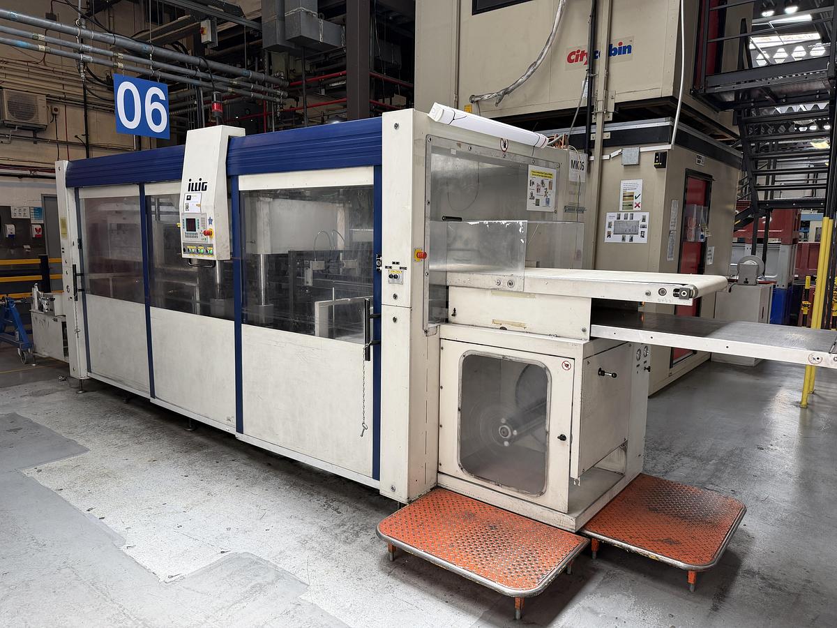 Used 500mm x 350mm Illig Model RD53 pressure forming machine 2004 with unwind and stacker