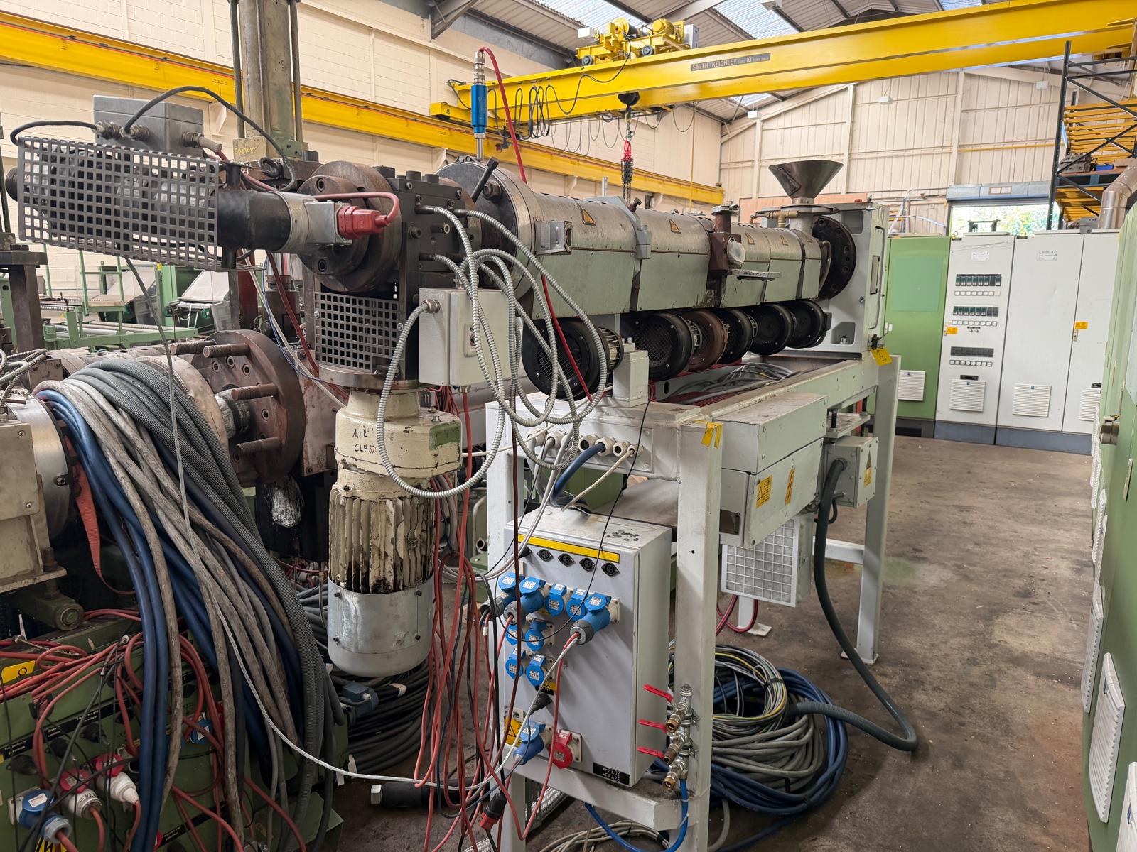 Used 60mm Kuhne 33D vented coextruder with 25kw dc motor. filter, and Normag gear pump. 2002