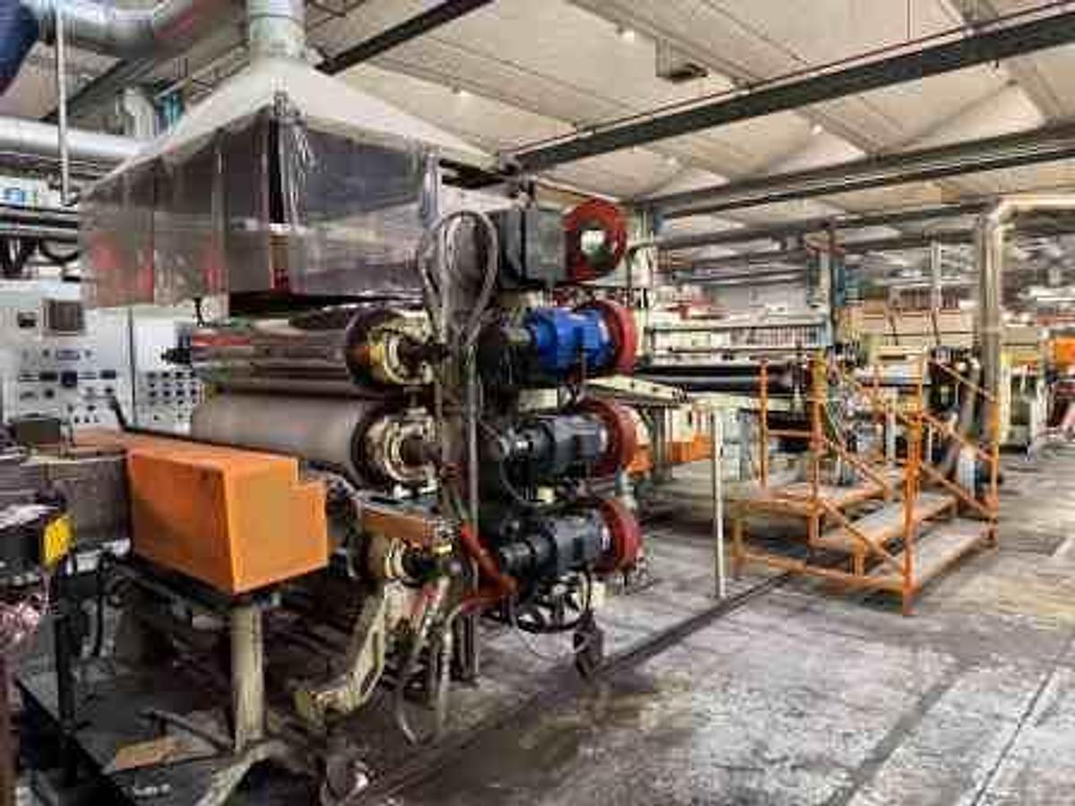 Used 1350mm wide Omipa coextrusion sheet line with 120mm 90mm 60mm extruders, feedblock,  1300mm x 400mm calender, pump group haul off, Guillotine. 1999