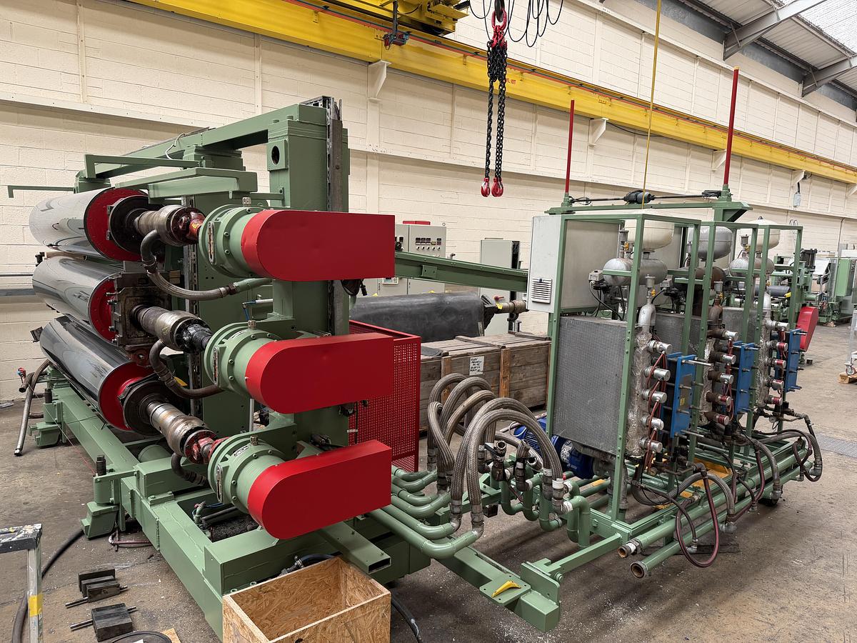 Used 2400mm wide Reifenhauser 3 roll polishing stack with thermoregulation, haul off. 2400mmx500mm individual drives. Variable speed haul off. In line knives.