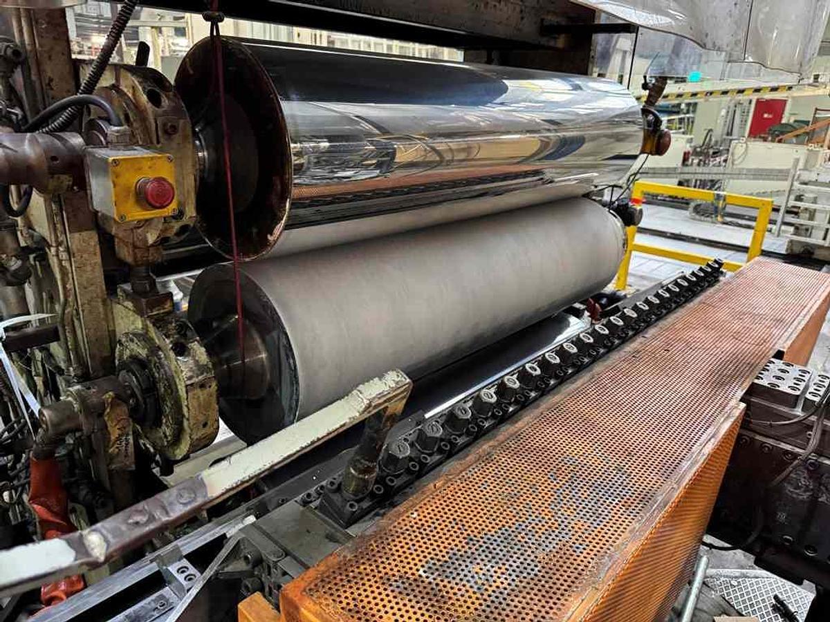 Used 1350mm wide Omipa coextrusion sheet line with 120mm 90mm 60mm extruders, feedblock,  1300mm x 400mm calender, pump group haul off, Guillotine. 1999