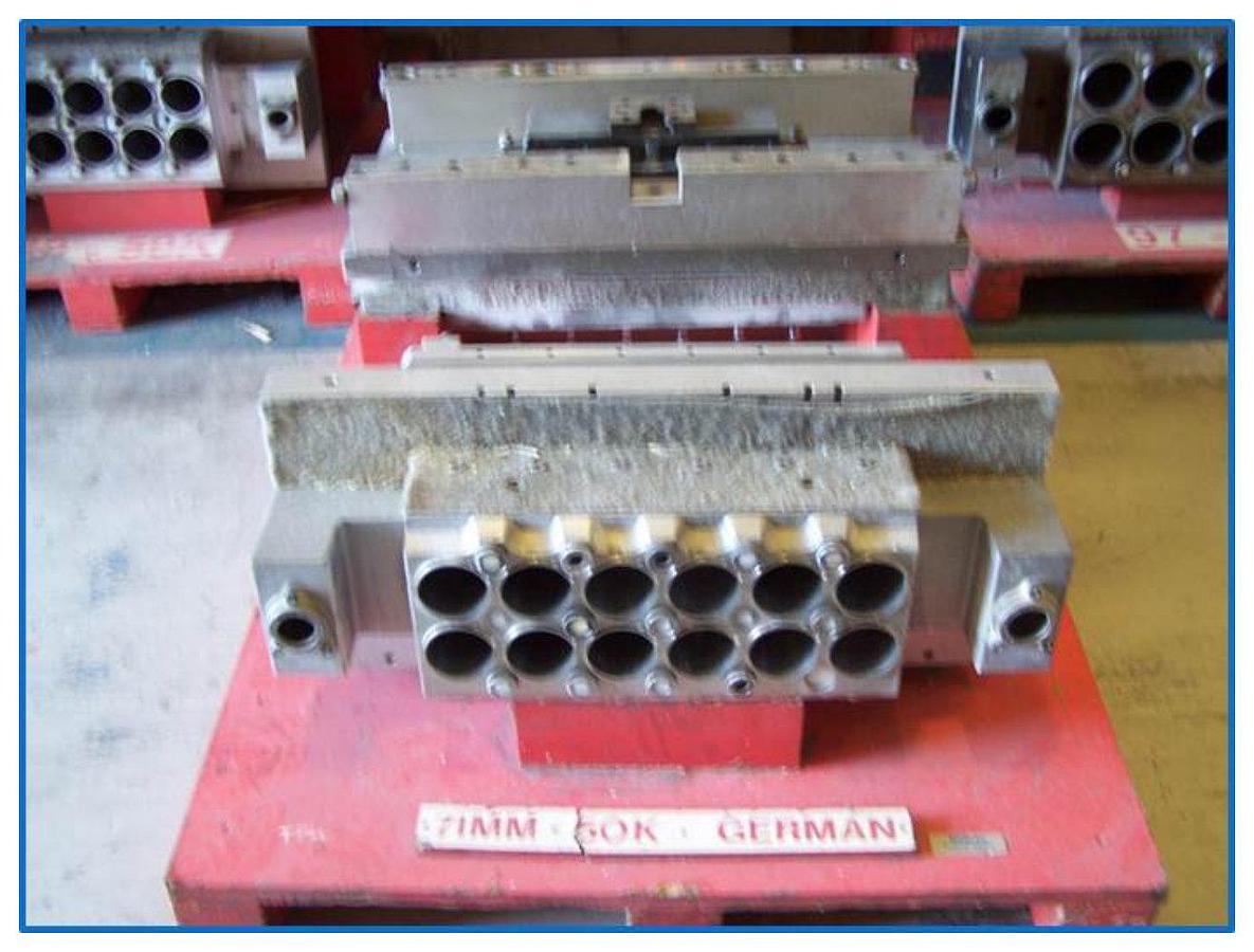 Used Illig RDM 50K 71mm 12 impression tool with stacker parts