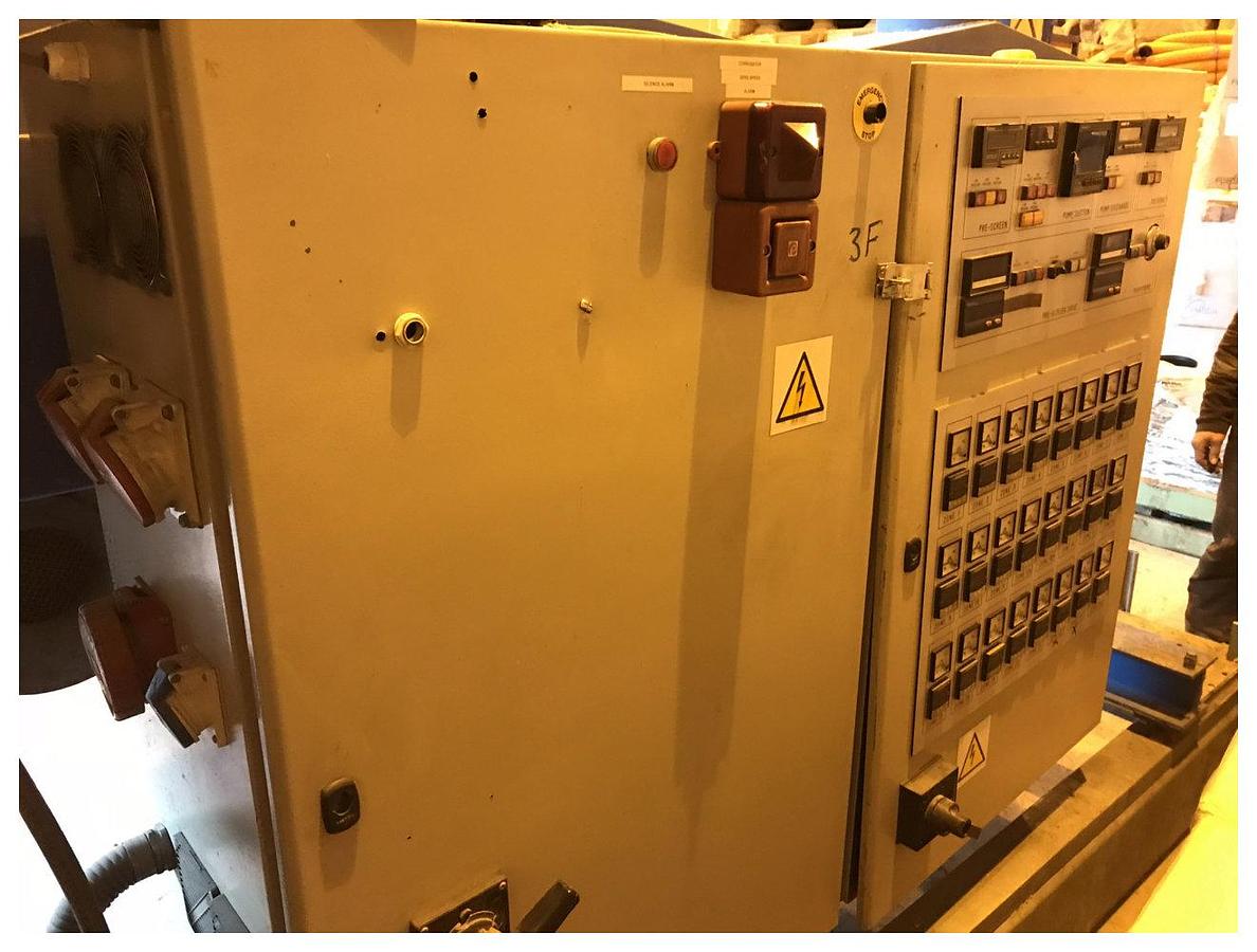 Used 90mm Dolci single screw extruder, 33D, with plugged vent. DC motor, approx 90kw. Electrically heated, fan cooled barrel. 20 zone temperature control panel