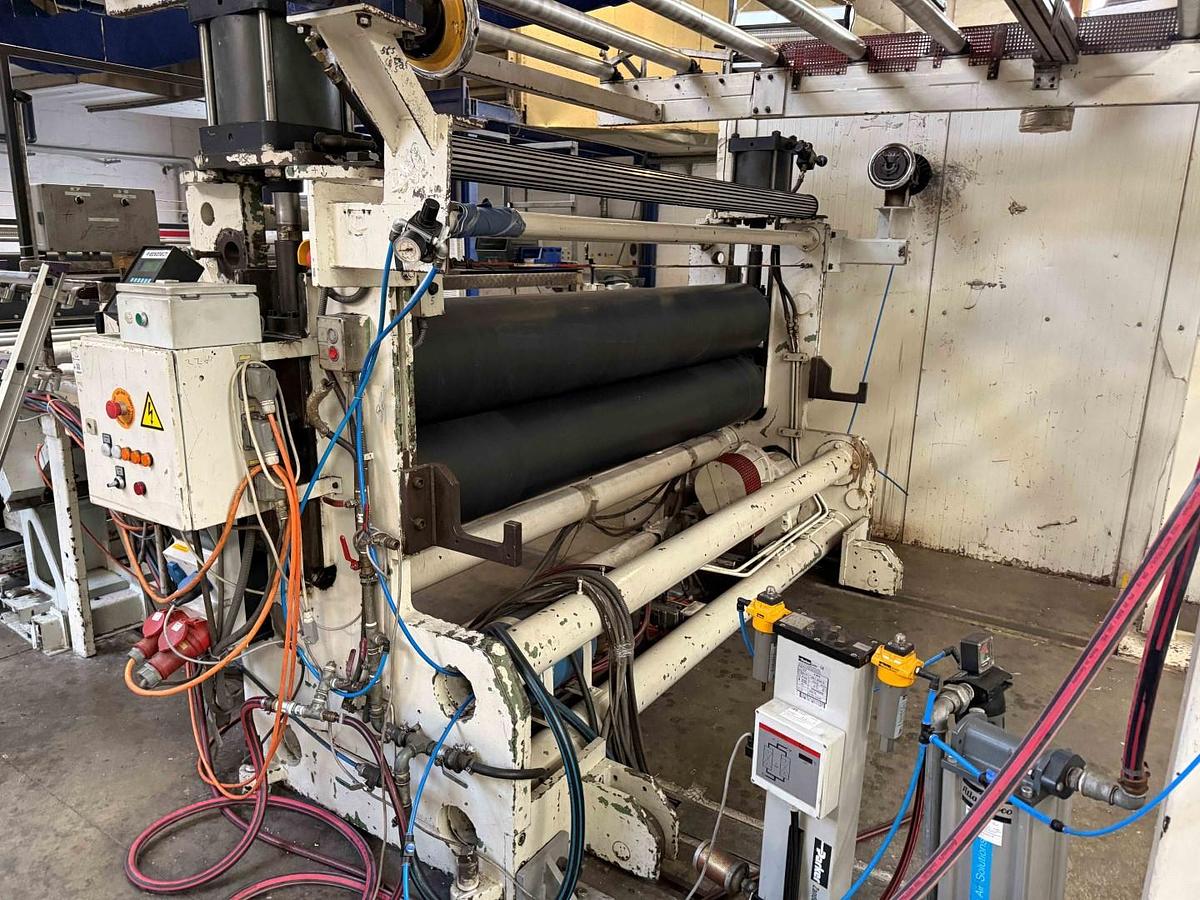 Used 2400mm wide Reifenhauser 3 roll polishing stack with thermoregulation, haul off. 2400mmx500mm individual drives. Variable speed haul off. In line knives.