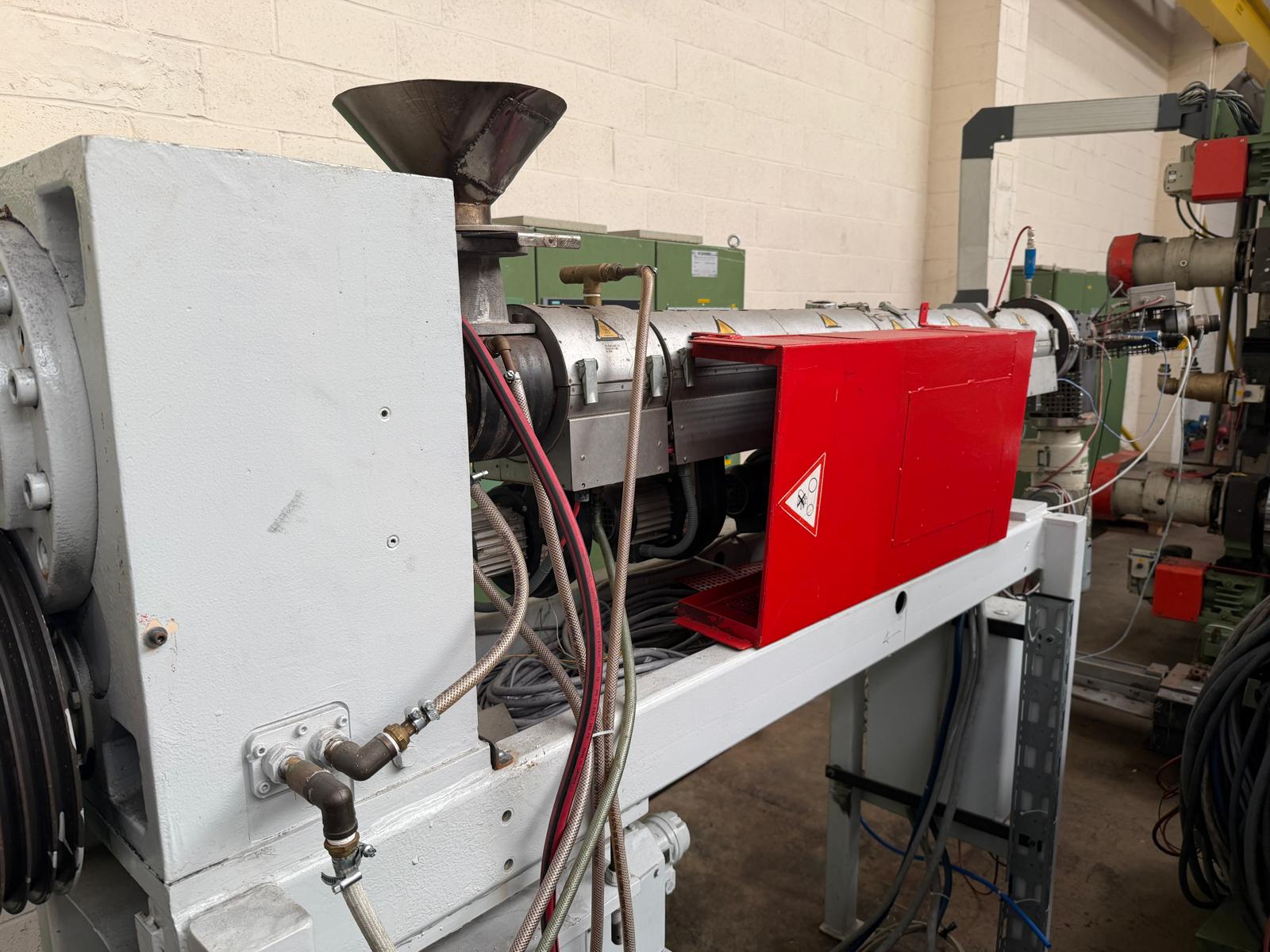 Used 60mm Kuhne 33D vented coextruder with 25kw dc motor. filter, and Normag gear pump. 2002