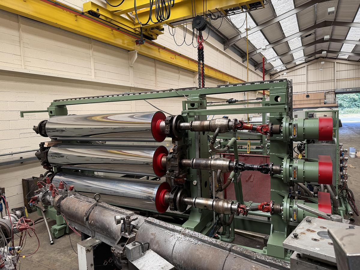 Used 2400mm wide Reifenhauser 3 roll polishing stack with thermoregulation, haul off. 2400mmx500mm individual drives. Variable speed haul off. In line knives.