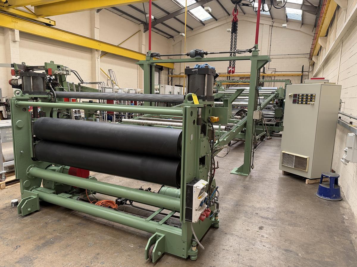 Used 2400mm wide Reifenhauser 3 roll polishing stack with thermoregulation, haul off. 2400mmx500mm individual drives. Variable speed haul off. In line knives.