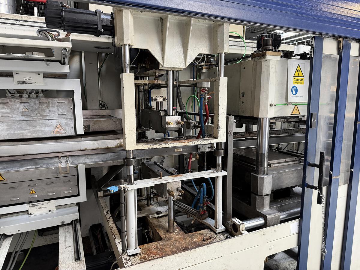Used 500mm x 350mm Illig Model RD53 pressure forming machine 2004 with unwind and stacker