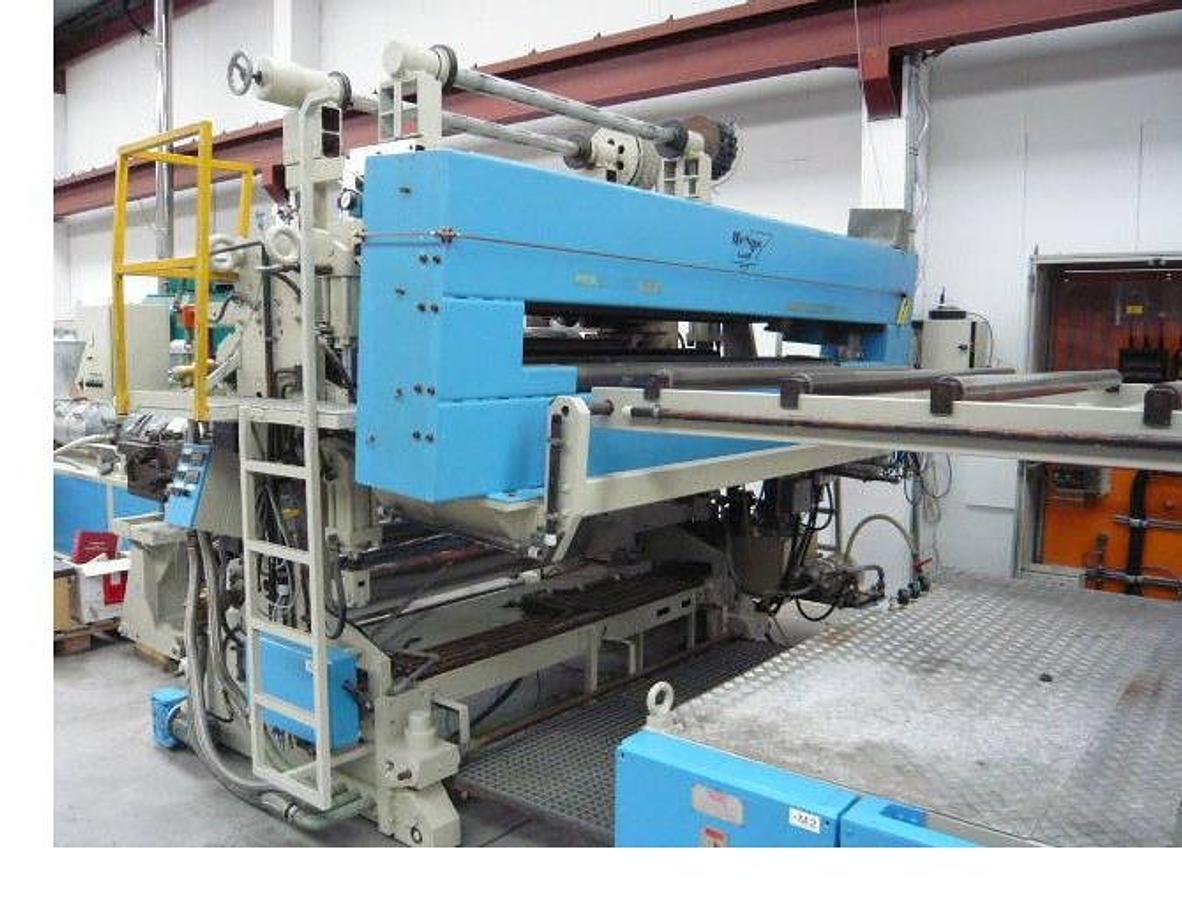 Used 1860mm wide Krauss Maffei Omipa sheet extrusion line. KMD130 Krauss Maffei extruder, 1800mm wide Omipa 3 roll stack, haul off, 2 station winder 1990