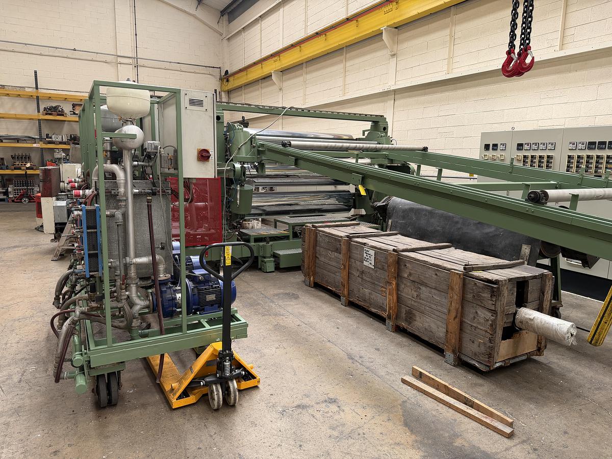 Used 2400mm wide Reifenhauser 3 roll polishing stack with thermoregulation, haul off. 2400mmx500mm individual drives. Variable speed haul off. In line knives.