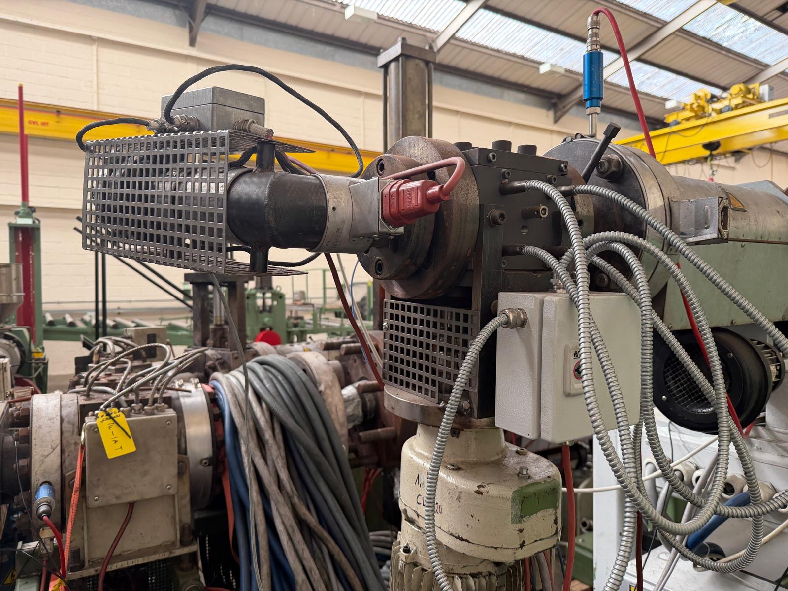 Used 60mm Kuhne 33D vented coextruder with 25kw dc motor. filter, and Normag gear pump. 2002