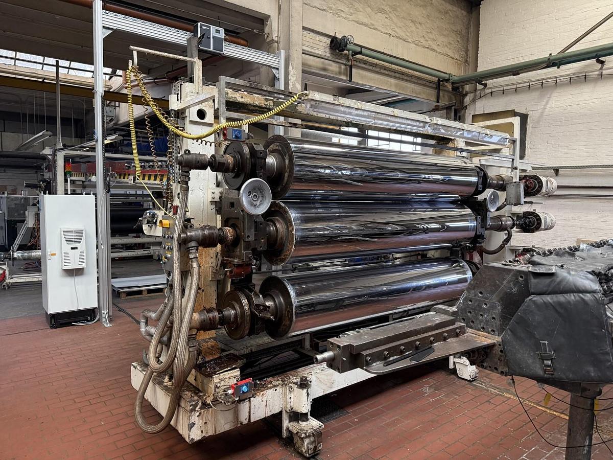 Used 2400mm wide Reifenhauser 3 roll polishing stack with thermoregulation, haul off. 2400mmx500mm individual drives. Variable speed haul off. In line knives.